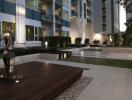 Modern apartment complex courtyard with statue