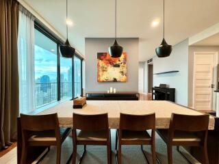 Modern dining area with large windows and city view