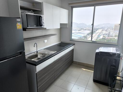 Modern kitchen with appliances and city view