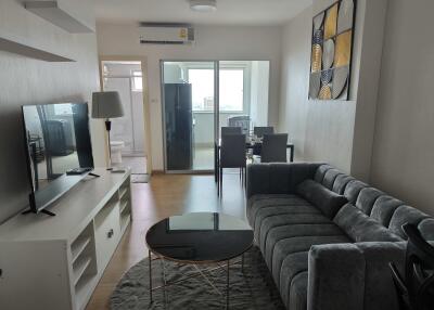 Spacious and modern living room with adjacent dining area