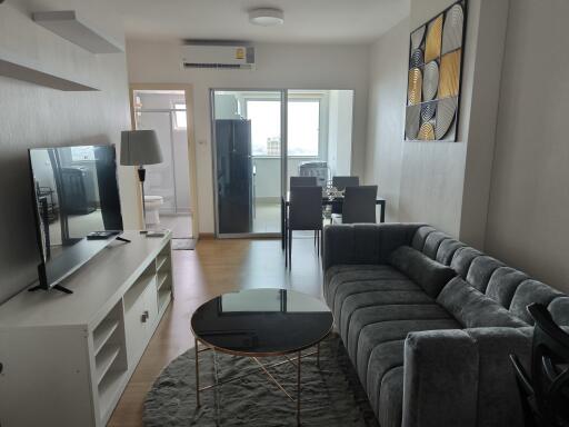 Spacious and modern living room with adjacent dining area