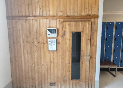 Building frontage with wooden door and informational display