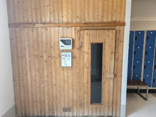 Building frontage with wooden door and informational display