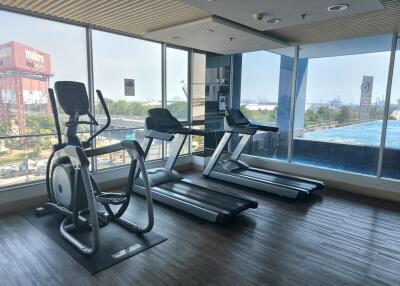 Well-equipped gym with cardio machines and panoramic view