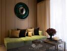 Modern living room with green sofa and decorative elements