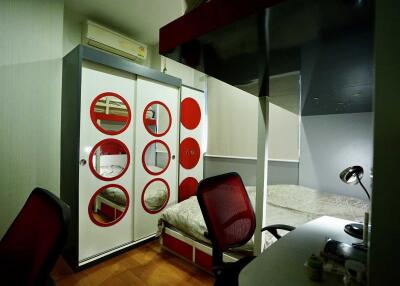Modern bedroom with bunk bed and circular design elements
