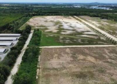 aerial view of expansive land with some infrastructure and greenery