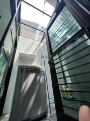 modern laundry area with large skylight