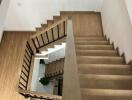 Wooden staircase with modern railing