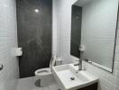 Modern bathroom with white tiles and dark accent wall