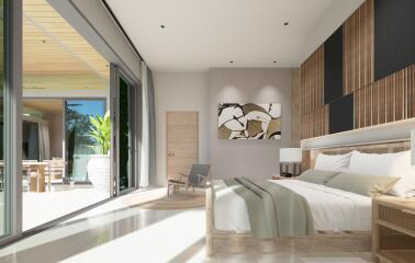 Spacious bedroom with modern decor and large glass door leading to a patio