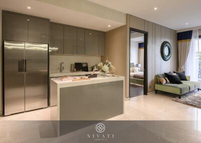 Modern kitchen and living area with stainless steel appliances