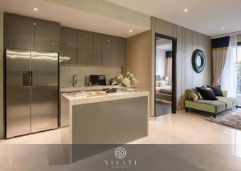 Modern kitchen and living area with stainless steel appliances