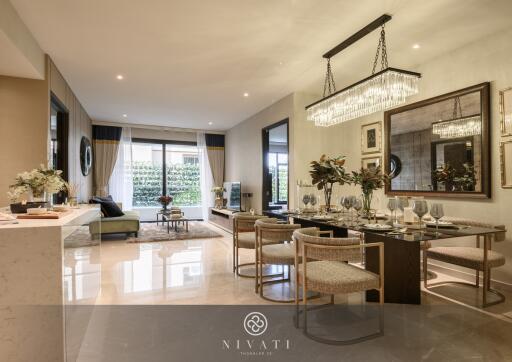 Spacious and elegantly decorated living and dining area with modern furniture and large windows