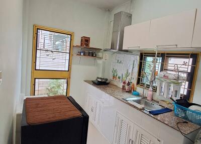 Well-lit kitchen with modern fittings and appliances