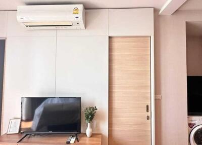 Modern living room with television and air conditioning