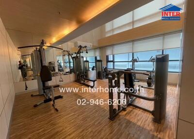 Modern gym area with various fitness equipment