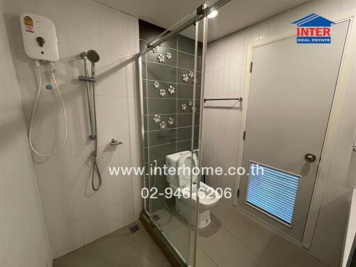 Modern bathroom with shower stall and toilet