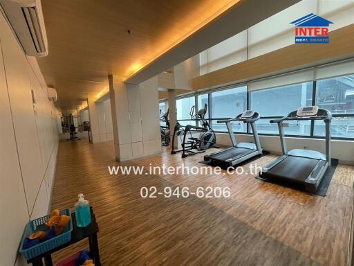 fitness center with treadmills and exercise equipment