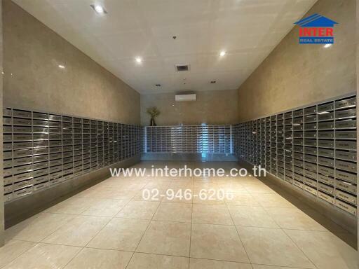 Mailroom with numerous mailboxes and tiled floor.