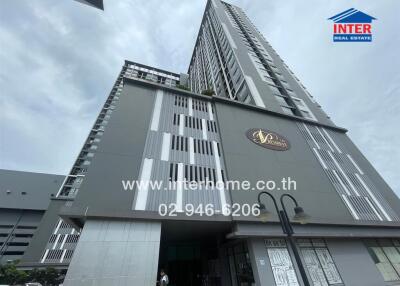 High-rise residential building with INTER Real Estate signage