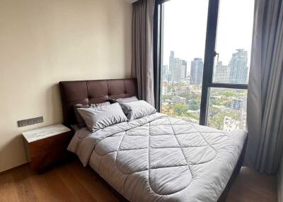 Cozy bedroom with city skyline view