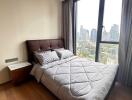 Cozy bedroom with city skyline view