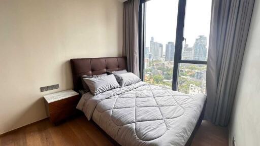 Cozy bedroom with city skyline view