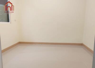 Empty bedroom with window and tiled floor