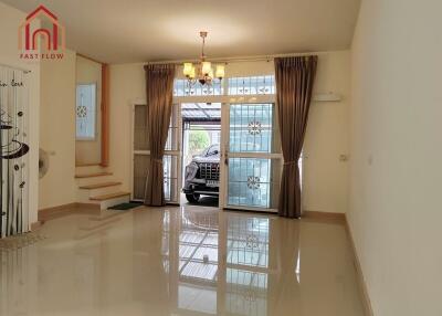 Living room with bright lighting and view of garage