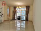 Living room with bright lighting and view of garage