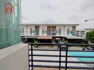 View from the balcony overlooking a row of modern townhouses