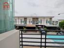 View from the balcony overlooking a row of modern townhouses