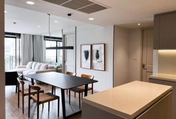 Modern living room with dining area and open kitchen