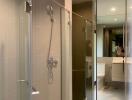 Modern bathroom with glass shower and large mirrored cabinet