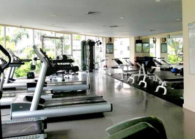 Gym with modern equipment and large windows for natural light