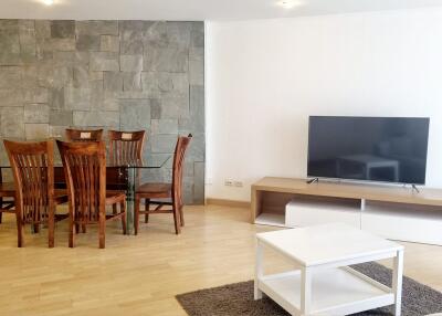 Modern living and dining area with wooden furniture