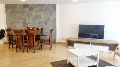 Modern living and dining area with wooden furniture