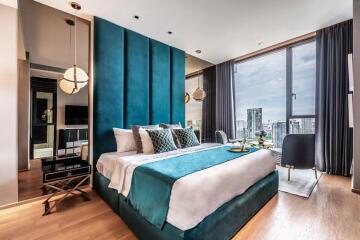 Modern bedroom with a city view through large windows