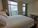 Spacious bedroom with city view