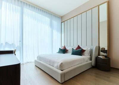 Modern bedroom with large windows and natural light