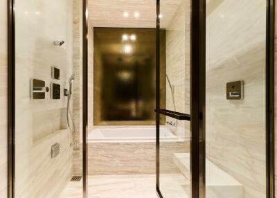 Modern bathroom with glass-enclosed shower and soaking tub