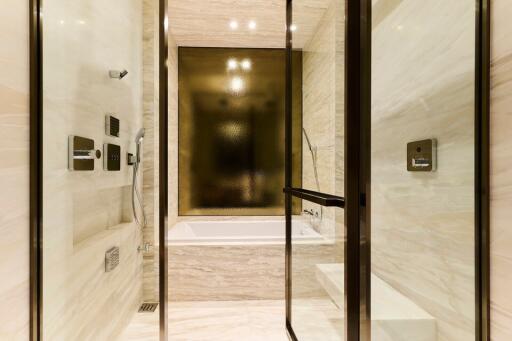 Modern bathroom with glass-enclosed shower and soaking tub