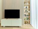 Modern living room with TV and built-in shelving