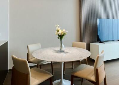 Modern dining area with a round table and chairs