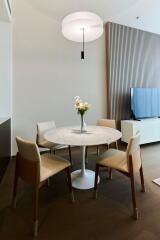 Modern dining area with a round table and chairs