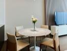 Modern dining area with a round table and chairs