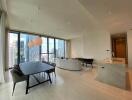 spacious and modern living area with a dining table and a city view