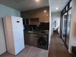 Modern kitchen with appliances and hallway view