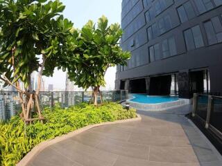 High-rise apartment building with rooftop pool